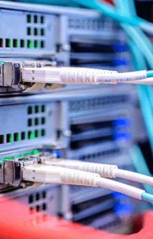 A close-up of a server rack filled with various cables for a computer