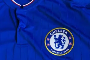Close up of a Chelsea shirt showing the football club's logo